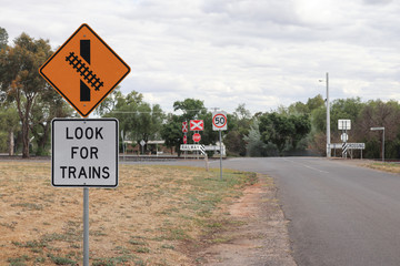 Look For Trains and other warning signs approaching a railway crossing