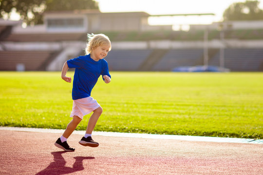 Child Running In Stadium. Kids Run. Healthy Sport.