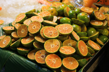 Fresh chopped orange slices food background, Fresh orange color for use in making the background, Orange Slices for sale at the market, Orange cut pieces juicy delicious and healthy fruit fruit drink.