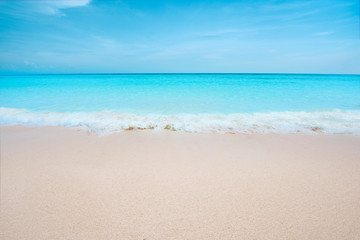 Fototapeta na wymiar Soft Blue Ocean Wave On Sandy Beach. View of nice tropical beach. Holiday and vacation concept. Tropical beach.