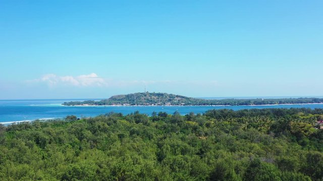 Small islands in the beautiful endless ocean. Aerial seascape. Bali, Gilli islands
