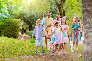 Family with kids on Easter egg hunt