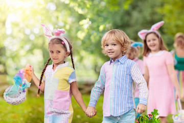 Family with kids on Easter egg hunt