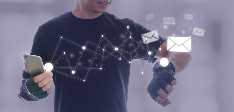 Asian athletes man wearing fitness gloves are resting after exercising. And use a smartphone with smartwatch to checking email massage data.Concept of sport and technology. - Powered by Adobe