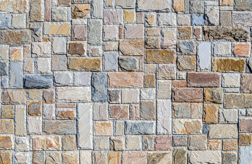 Wall of colored artificial stone as a background.