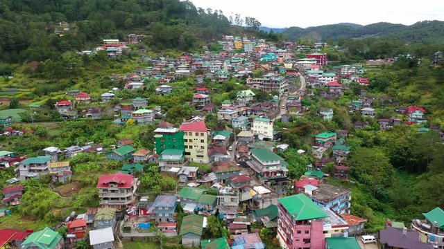 Aerial view town of Sagada, located in the mountainous province of Philippines. City in the valley among the mountains covered with forest. Sagada-Cordillera region-Luzon island.