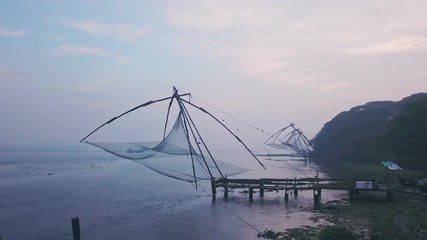 Traditional Chinese fishing nets, Fort Kochi, India. Aerial drone view at sunrise