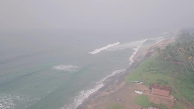 Fishing boat at a beach in India. Aerial drone view