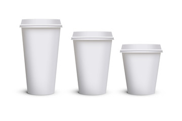 White blank takeaway paper, carton or cardboard coffee cup in different size on isolated white background, including clipping path for cutout. Empty tea mockup for presentation on isolated background.