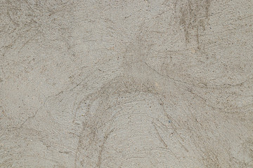 Cement plastered wall with cracks as background