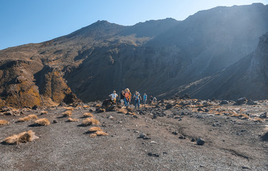 Tongariro, New Zealand - December 27, 2019 : People Trekking at Tongariro Alpine Crossing in New Zealand