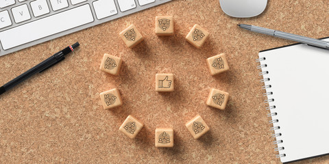 cubes showing a brainstorming session at a modern computer workspace on cork background