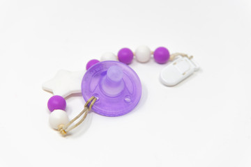 isolated purple pacifier on white background