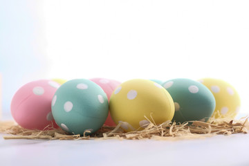 Close up of colorful easter eggs on white background 