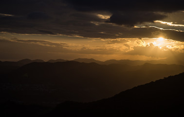 dramatic colourful sunset image in the caribbean mountains of the dominican republic.