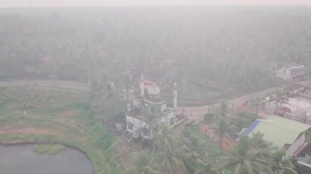Hindu temple near Varkala in India at sunrise. Aerial drone view
