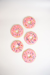 Pink sugar cookies decorated like donuts