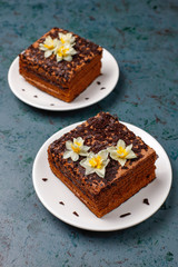 Tasty homemade chocolate truffle cakes with coffee on dark background