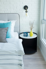 Decorative wall light in bedroom.Stylish interior of comfortable bedroom.