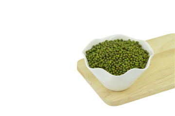 dry mung beans in a ceramic bowl isolated on white background