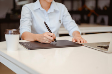 Businessman sitting to working at office desk have a coffee cup beside for efficient work  problems and concepts. businessman, working, business, technology, management, planning concepts.