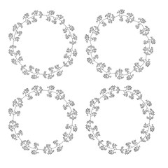 Wreaths from twigs and leaves. Set of four cute  vector circle floral frames isolated on white background.
