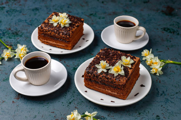 Tasty homemade chocolate truffle cakes with coffee on dark background