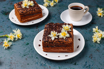 Tasty homemade chocolate truffle cakes with coffee on dark background
