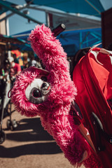 Sloth plush on a stroller