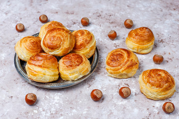 Azerbaijan national pastry qogal on white plate on light background ,top view,spring new year celebration Novruz holiday.