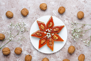 Azerbaijan national pastry pakhlava on white plate on light background ,top view,spring new year celebration Novruz holiday.