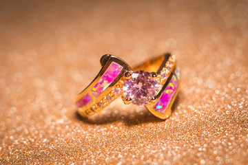 Golden ring with pink zircon