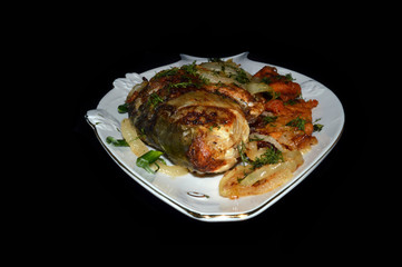 fried fish isolated on black background