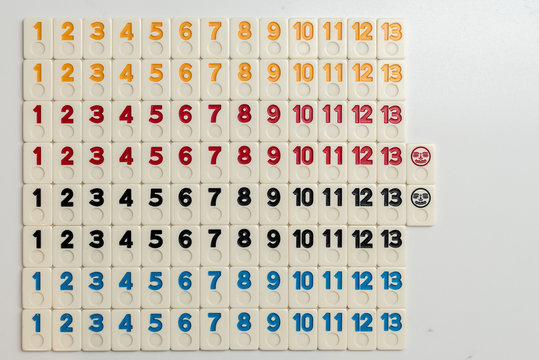 Grid of numbers in colors from 1 to 13 made out of rummy pieces