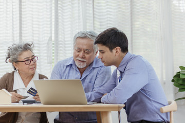 Stressed and serious retired Asian senior eldery couple consult with personal financial advisor or...