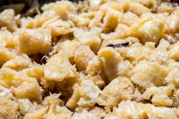 Fish maw soup in a big saucepan. ฺBraised fish maw with red gravy sauce in big pan on market. Close up of braised fish maw in red gravy.