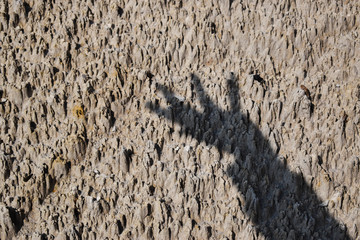 Shadow of hand on rough surface
