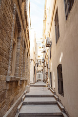 Fototapeta na wymiar Narrow street of the Old city, toned