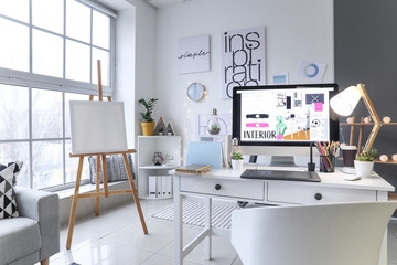 Interior of modern office with designer's workplace