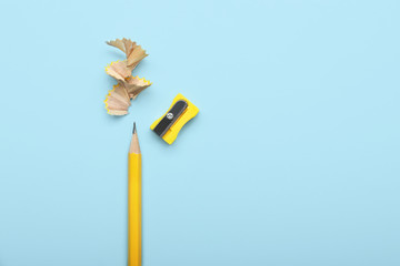 Ordinary pencil and sharpener on color background - Powered by Adobe