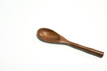 Close up spoon wood on white background.