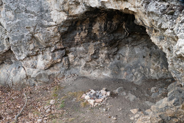 entrance to a limestone cave in the czech karst