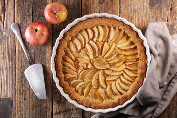 delicious apple pie on wooden board