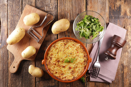 baked mashed potato with minced beef and salad