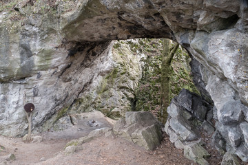 entrance to a limestone cave in the czech karst
