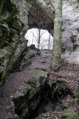 entrance to a limestone cave in the czech karst
