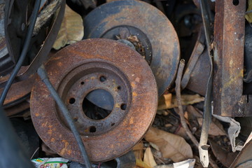 Junk yard full of car's part , engine , body.