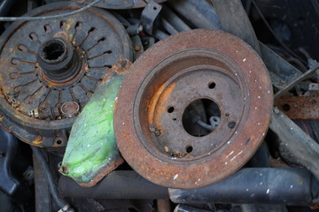 Junk yard full of car's part , engine , body.