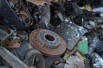 Junk yard full of car's part , engine , body.