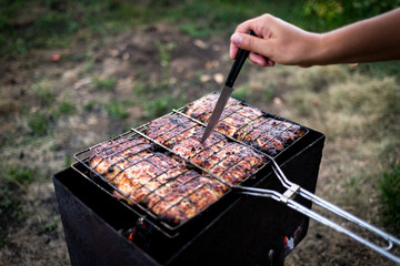 meat on the grill. knife readiness check